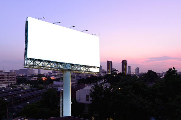 Blank billboard for advertising with cityscape sunset background. - Photo, Image