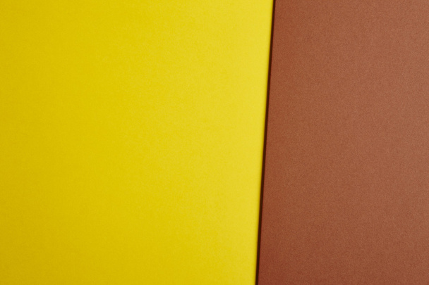 Colored cardboards background in yellow, brown tone. Copy space - Zdjęcie, obraz