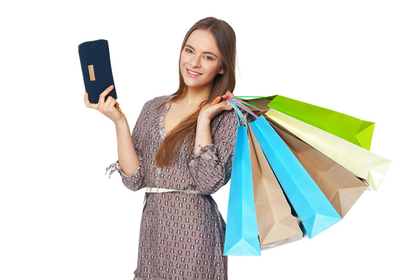 Happy beautiful woman with shopping bags isolated on white. - 写真・画像