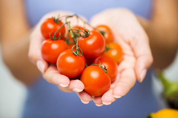 close up of woman holding cherry tomatoes in hands - Φωτογραφία, εικόνα