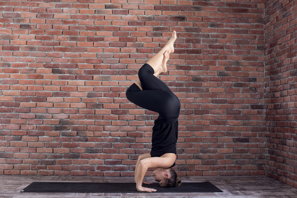 woman practicing yoga - Fotó, kép