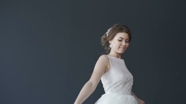 Beautiful young bride in white wedding dress spinning. Pretty woman - Felvétel, videó
