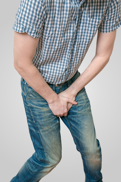 Incontinence concept. Man wants to pee and is holding his bladde - Φωτογραφία, εικόνα