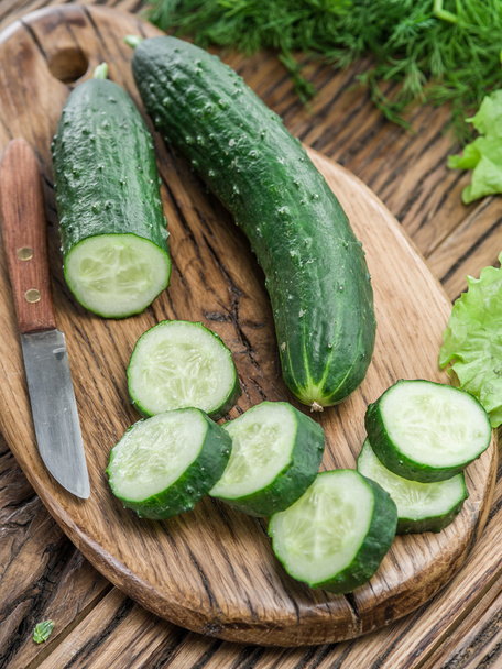Cucumbers on the wooden table. - Foto, imagen
