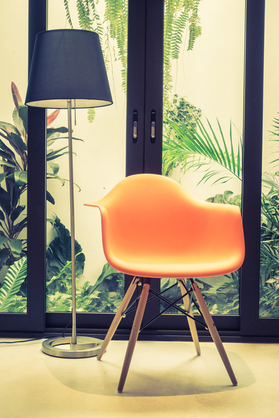 Orange chair with light lamp - Foto, Bild