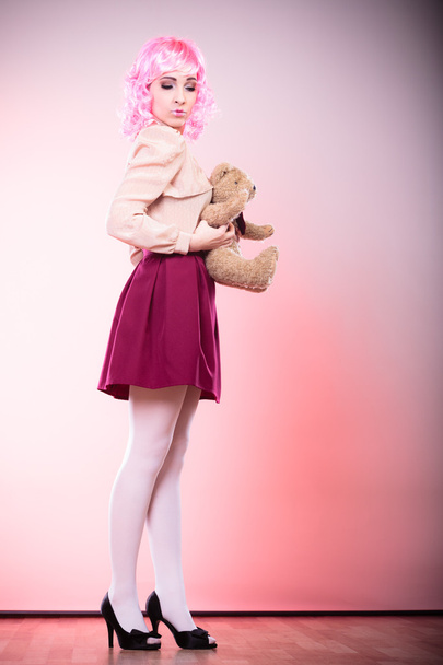 childlike woman with teddy bear toy - Fotografie, Obrázek