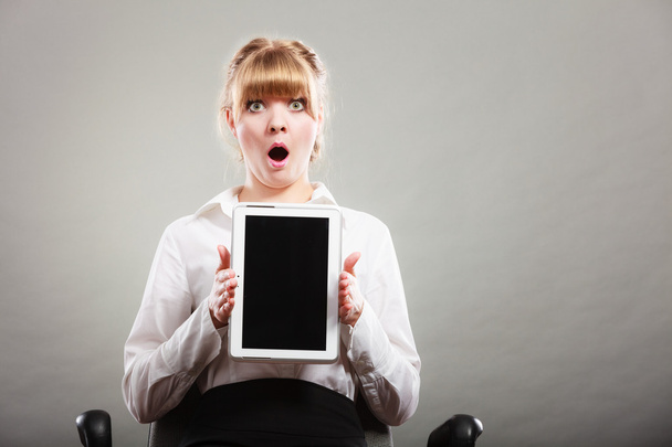 Woman with tablet. Blank screen copy space. - Фото, изображение