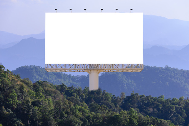 Blank billboard for advertising with forest background, advertising everywhere concept. - Photo, Image
