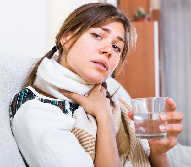 Woman suffering taking antibiotic against fever - Фото, изображение