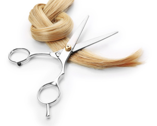 scissors with strand of blonde hair  - Фото, изображение