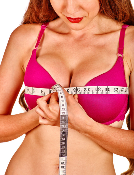Girl in lingerie measures her breast measuring tape. - Photo, Image
