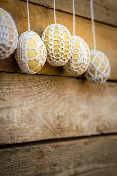 Crochet pattern Easter eggs on wooden background - Фото, зображення
