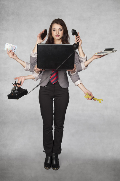 multipurpose business woman on the grey background - Foto, immagini