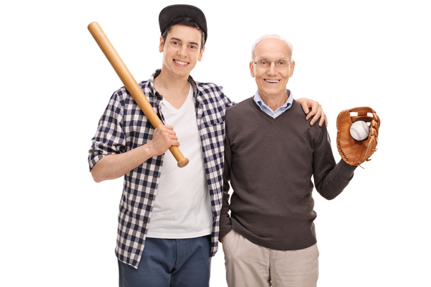 Father and son posing with baseball equipment - Fotó, kép