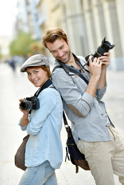 photographers with cameras standing - Фото, зображення