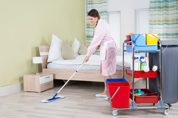 Female Housekeeper Mopping Floor - Fotografie, Obrázek