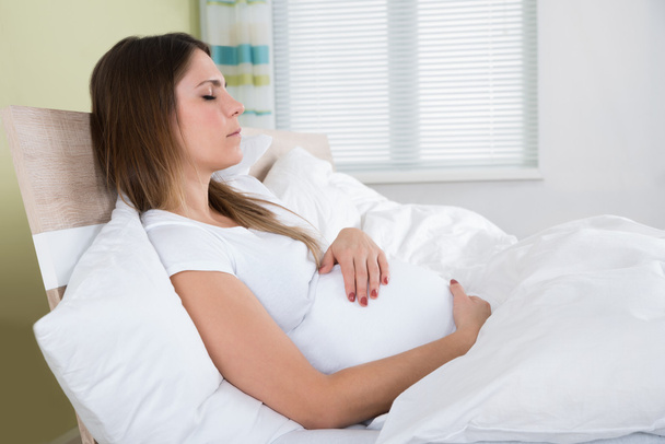 Pregnant Woman With Eyes Closed - Fotografie, Obrázek