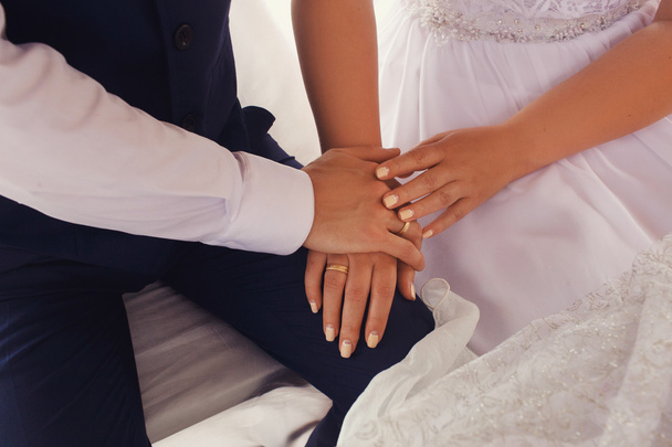 bride and groom holding hands close up - Фото, изображение