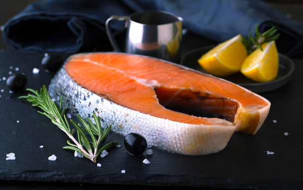 Raw salmon with lemon and spices - Photo, Image