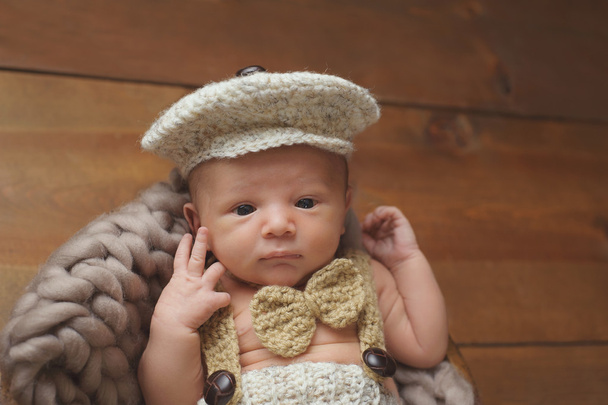 Newborn Baby Boy Wearing a Newsboy Cap and Bowtie - Photo, Image