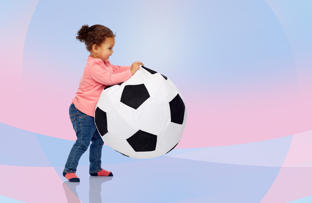 happy mulatto little baby girl playing with ball - 写真・画像