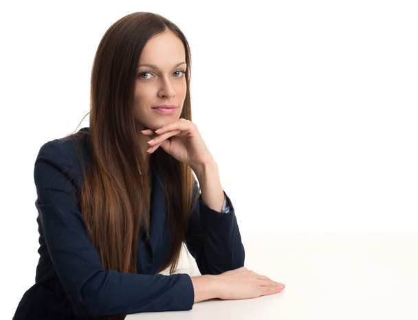 smiling businesswoman sitting at her desk - Fotografie, Obrázek