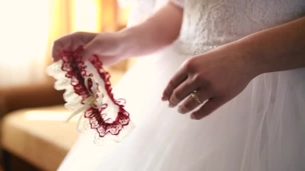 the bride at a wedding holding accessory - Filmati, video