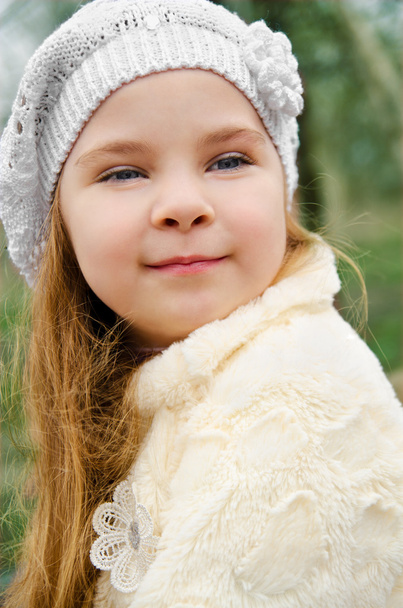 Portrait of smiling little girl outdoors on a spring day - Фото, зображення