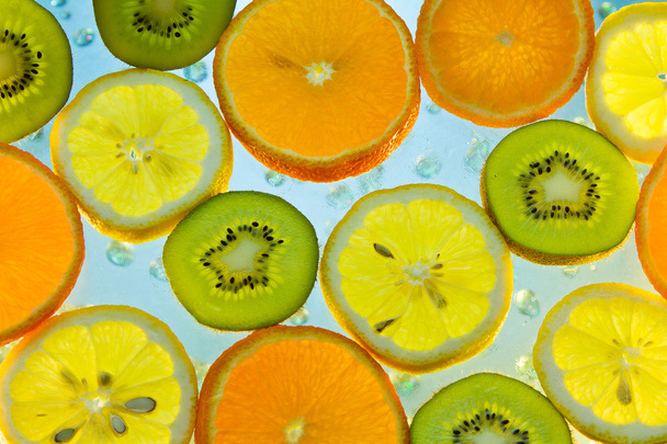 Background of fruit in water with bubbles - Foto, afbeelding