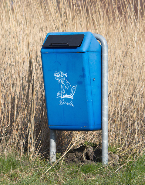 Close up of bright blue dog mess poop bin - Photo, Image