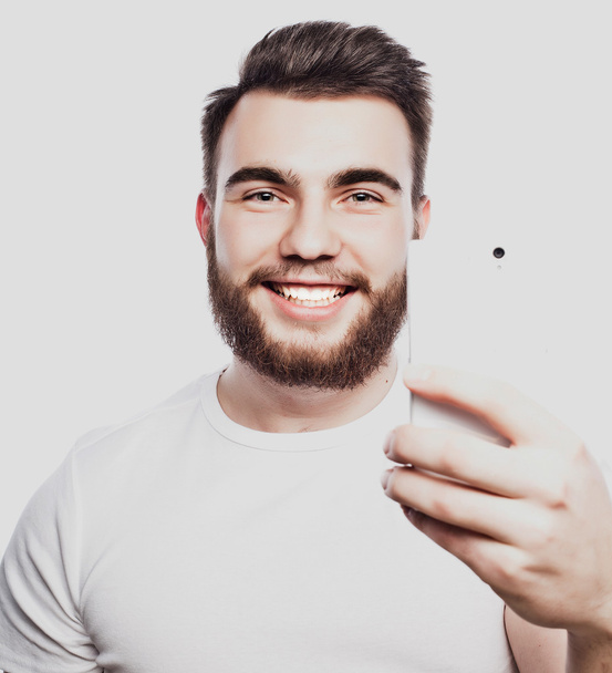 young bearded man with mobile phone - Foto, Imagem