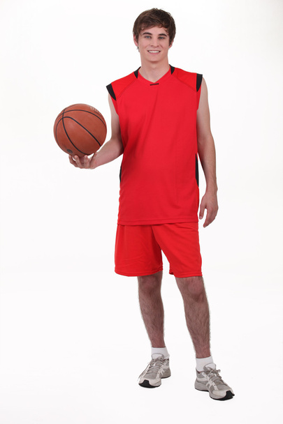 Studio portrait of a basketball player wearing a red kit - Foto, Imagen