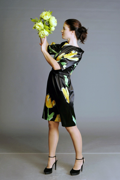 summer dress, dress in a floret, girl with flowers, bouquet, beautiful bouquet in hands at the girl - Fotografie, Obrázek