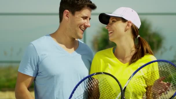 Tennis partners standing on tennis court - Footage, Video