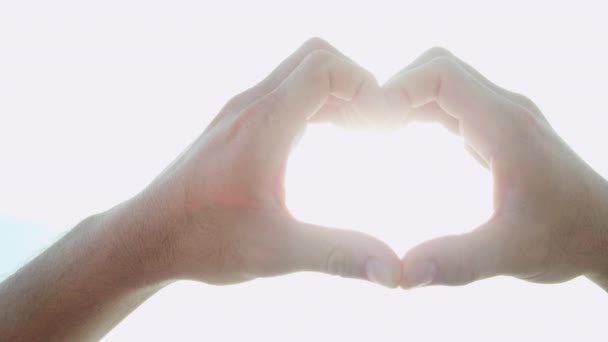 Male hands making heart shape - Footage, Video