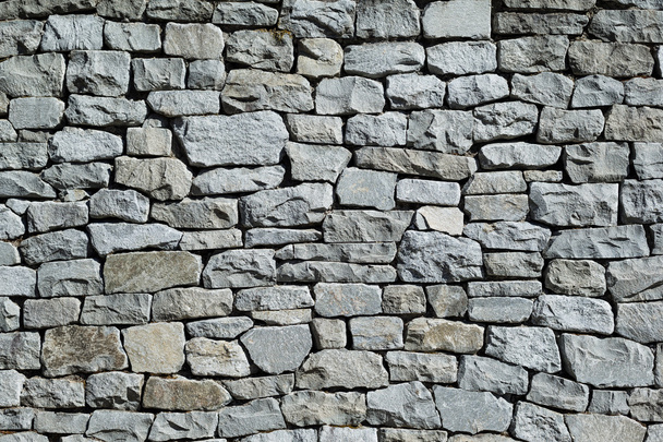 Grijze stenen muur  - Foto, afbeelding