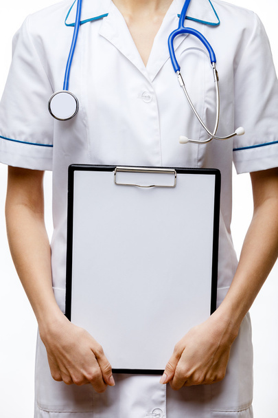 Woman doctor standing on white background - Fotó, kép