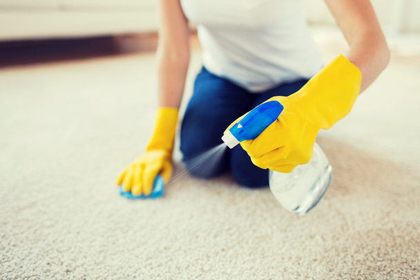 close up of woman with cloth cleaning carpet - Photo, image