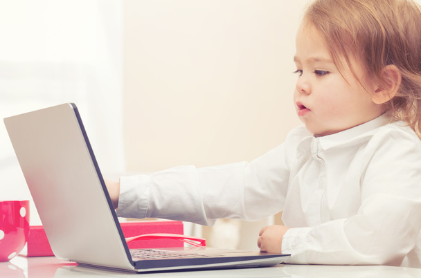 Happy toddler girl on her laptop - Fotografie, Obrázek