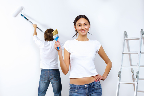 Young couple with paint brushes together - Photo, image
