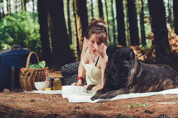 Girl on picnic with her big dog.  - Photo, image