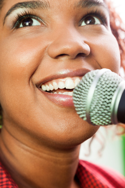 Happy Female Singer Looking Up While Performing - Foto, Imagem