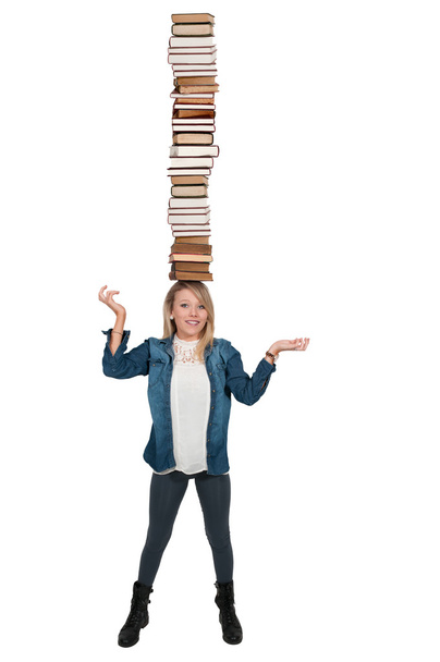 Woman balancing books - Фото, изображение