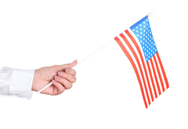 Female hand with American flag isolated on white - Fotó, kép