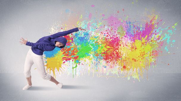 Young colorful street dancer with paint splash - Foto, Imagen