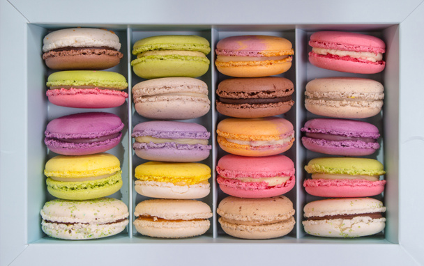 Assorted colorful macaroons in a box - Fotó, kép