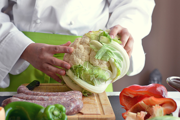 Chef cutting vegetables  - Фото, зображення