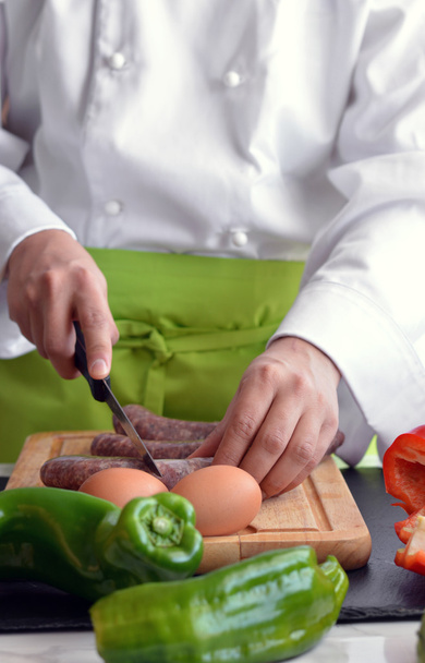 Chef cutting vegetables  - Foto, afbeelding