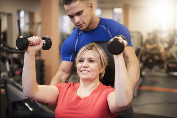 Woman working out with professional trainer - Photo, Image