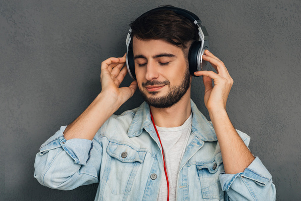 Young man with headphones - Фото, изображение